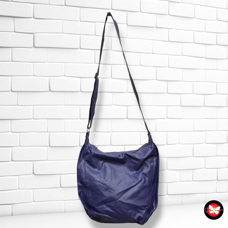 Bolso bandolera con bolsillos a los lados