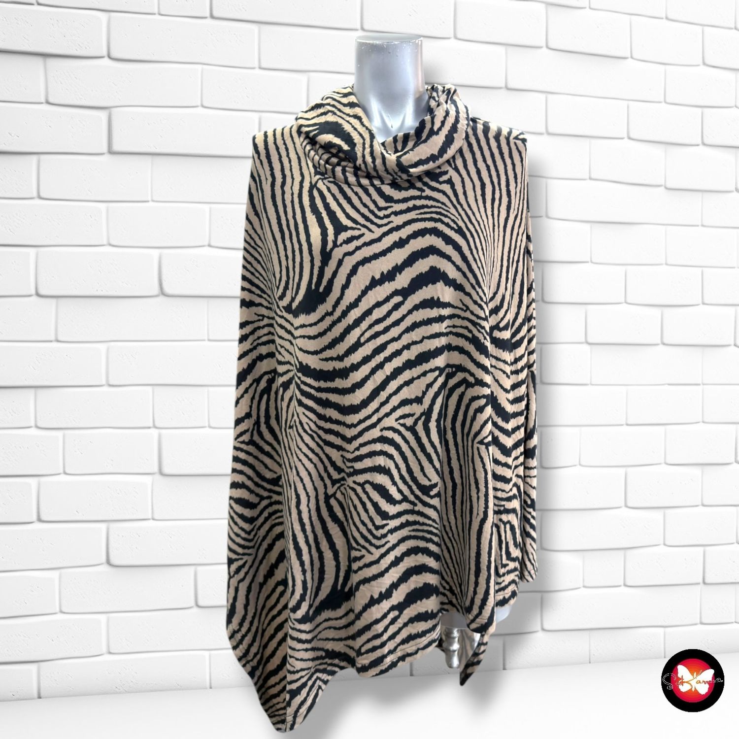 **HOY** Blusa asimétrica animal print  color Camel y negro Talla ÚNICA GRANDE