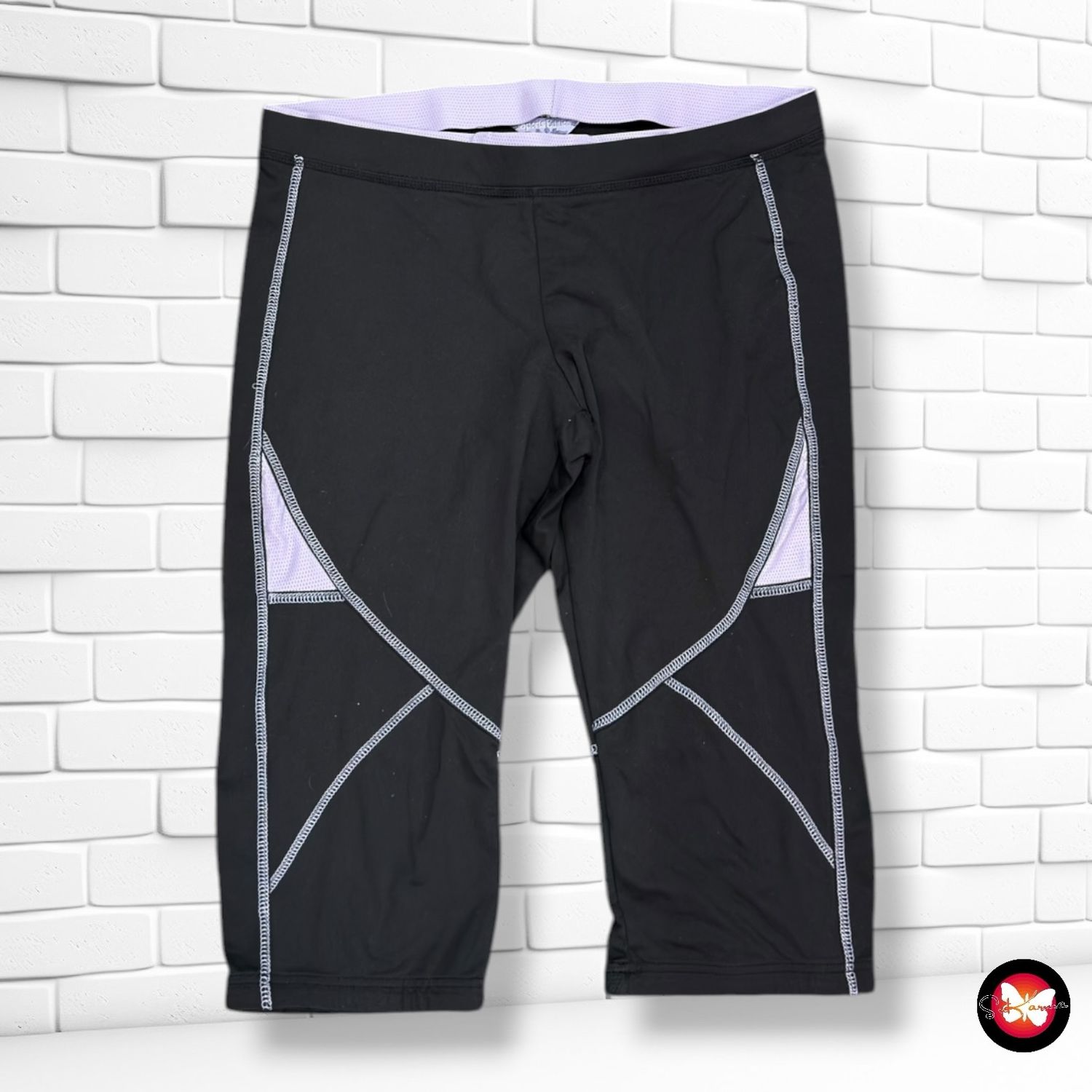 **HOY** Mallas deportivas piratas  color Negro y lila Talla 48