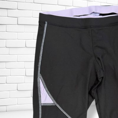 **HOY** Mallas deportivas piratas  color Negro y lila Talla 48