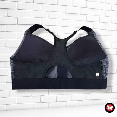 Top deportivo DOMYOS color Gris y negro Talla M/L