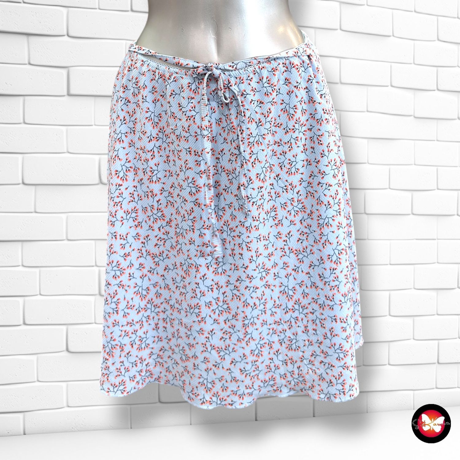 Falda de florecitas BLUE MOTION color Celeste y varios Talla 40/42