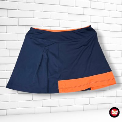 **HOY** Falda deportiva con mallitas CRANE color Azul marino y naranja Talla S