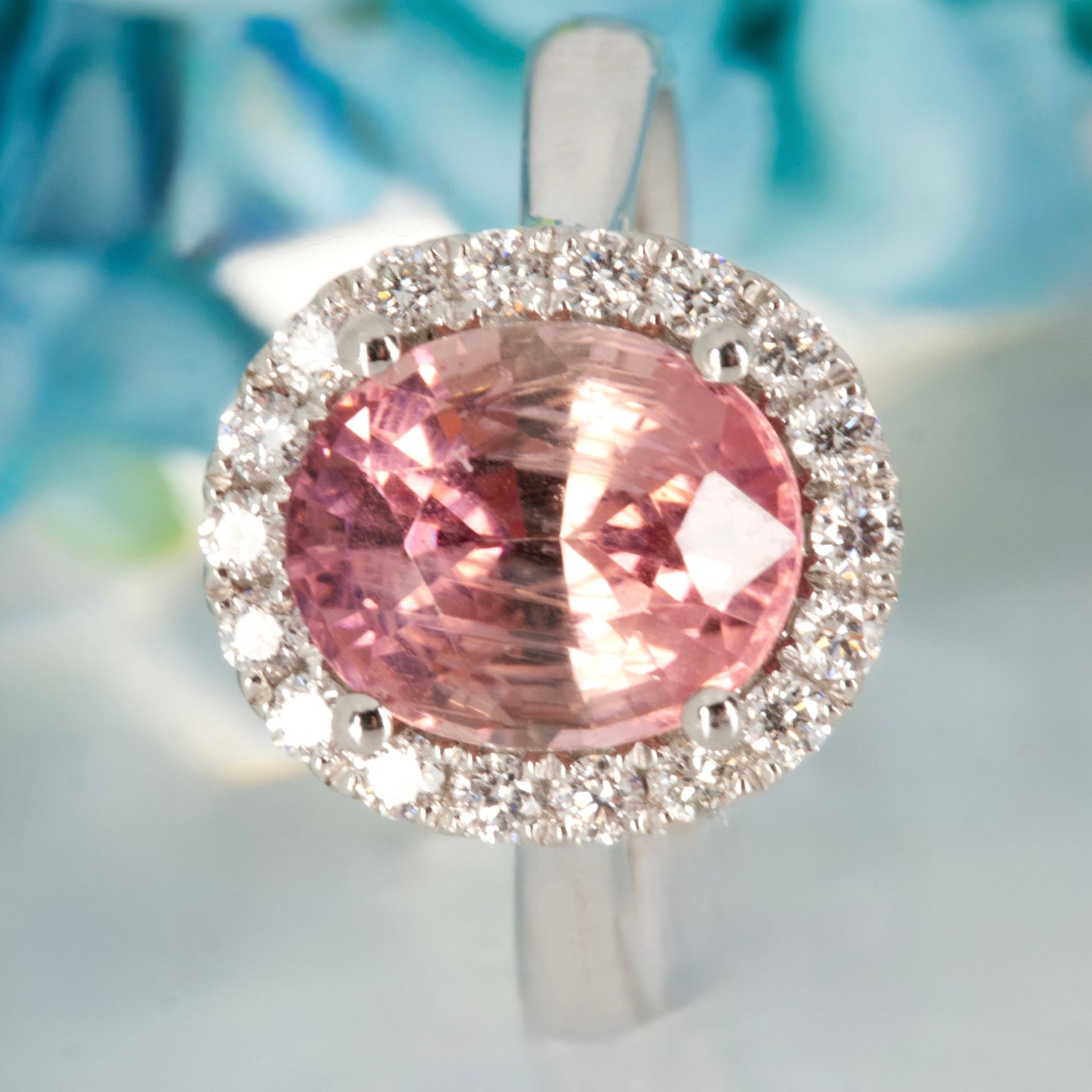 Platinum Oval Cut Pink Tourmaline & Round Brilliant Cut Diamond Halo Cluster Ring