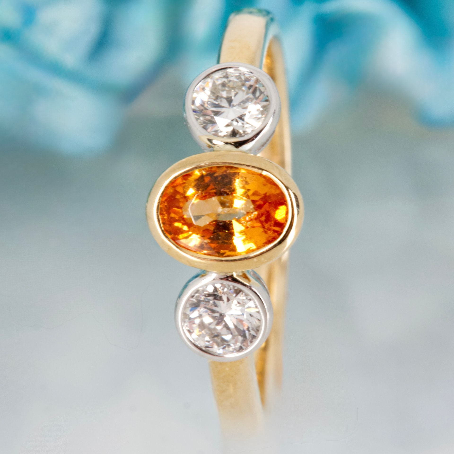 9ct Yellow Gold Oval Cut Mandarin Garnet & Round Brilliant Cut Diamond Trilogy Ring