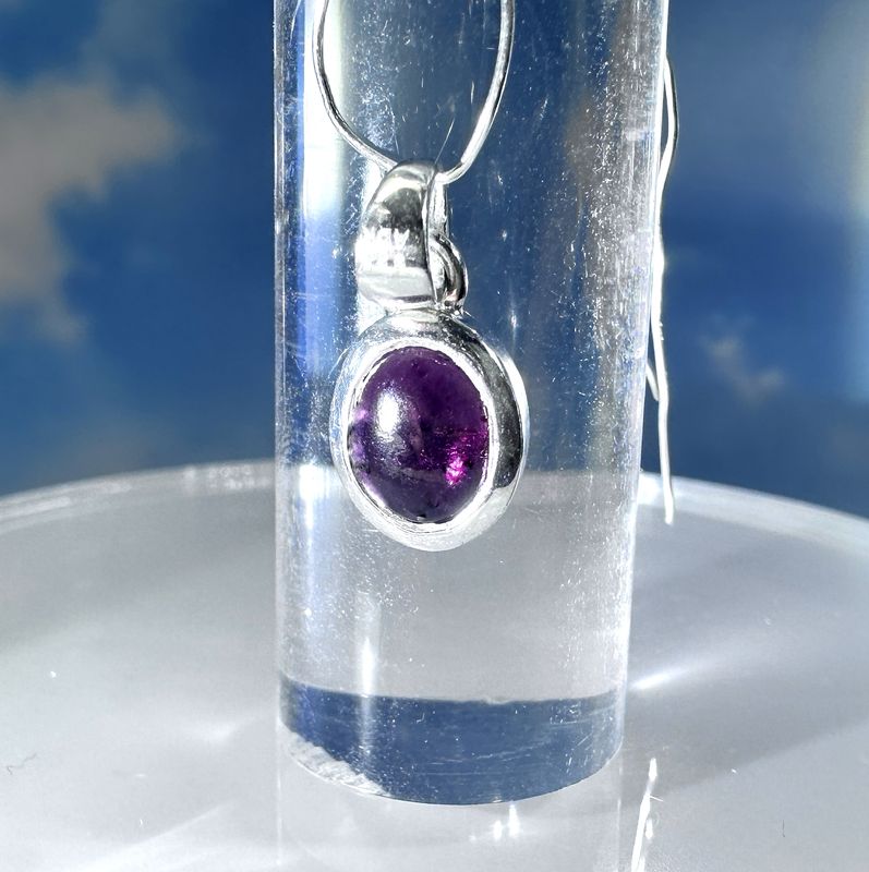 Elegant, sparkling pendant made from genuine garnet set in shiny 925 sterling silver. 