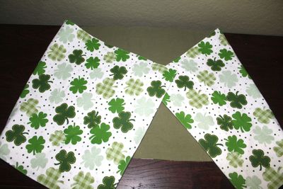 Handmade reversible shamrock and olive green table runner for St. Patrick’s Day table décor and dining table decoration.