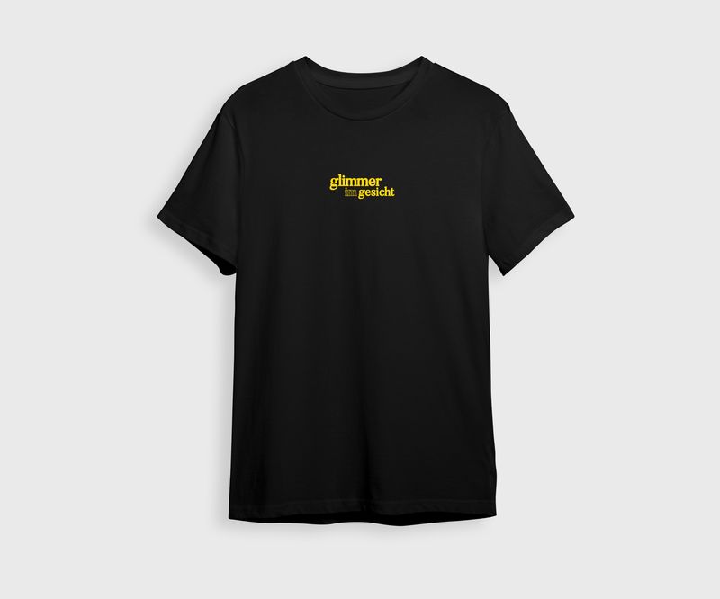 GLIMMER IM GESICHT BASIC T-Shirt– Malle Drop 2026