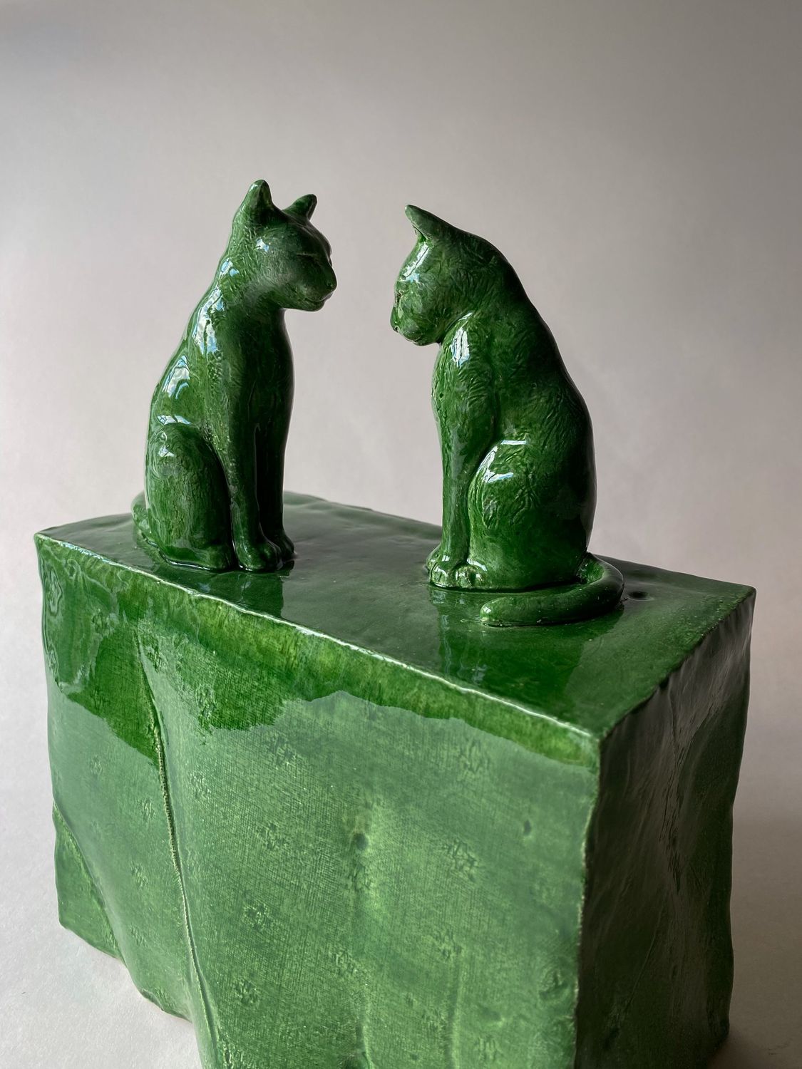 green cats on a green table cloth green cats on a green table cloth
