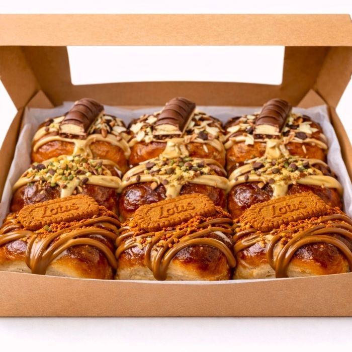 Box of 9 Easter brioche hot cross buns filled with pistachio, Bueno hazelnut chocolate, and Lotus Biscoff spread