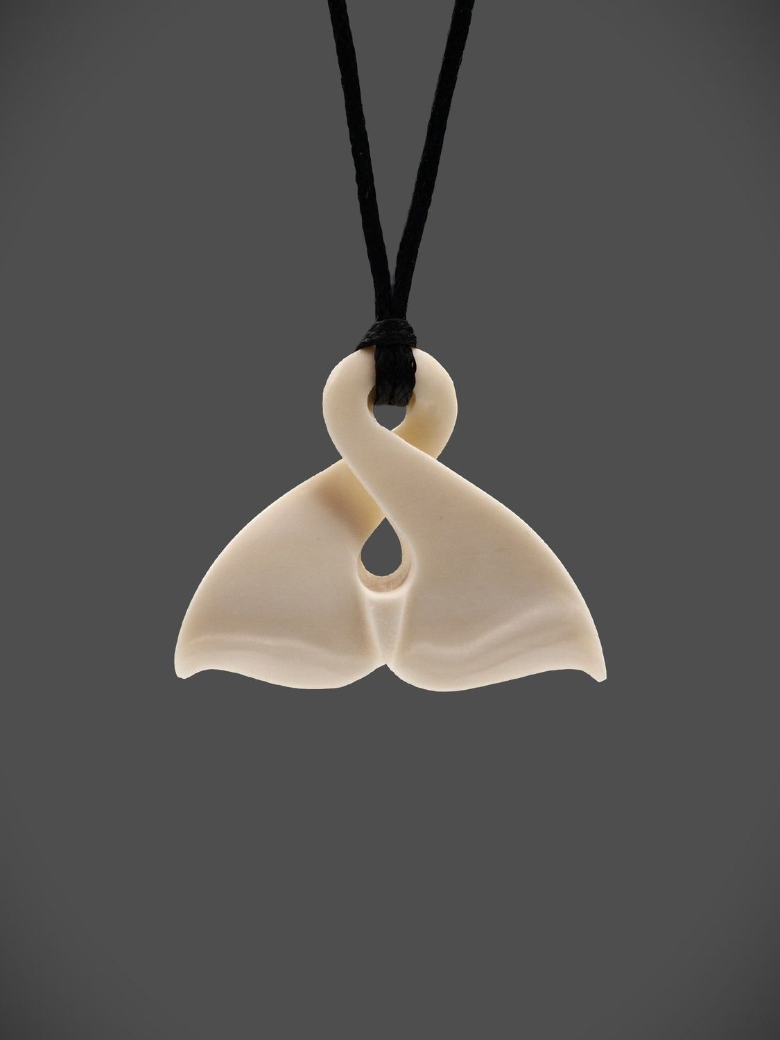 Moko Pounamu Pikorua Whale Tail Bone Carving - Omihi Moko Pounamu Pikorua Whale Tail Bone Carving - Omihi