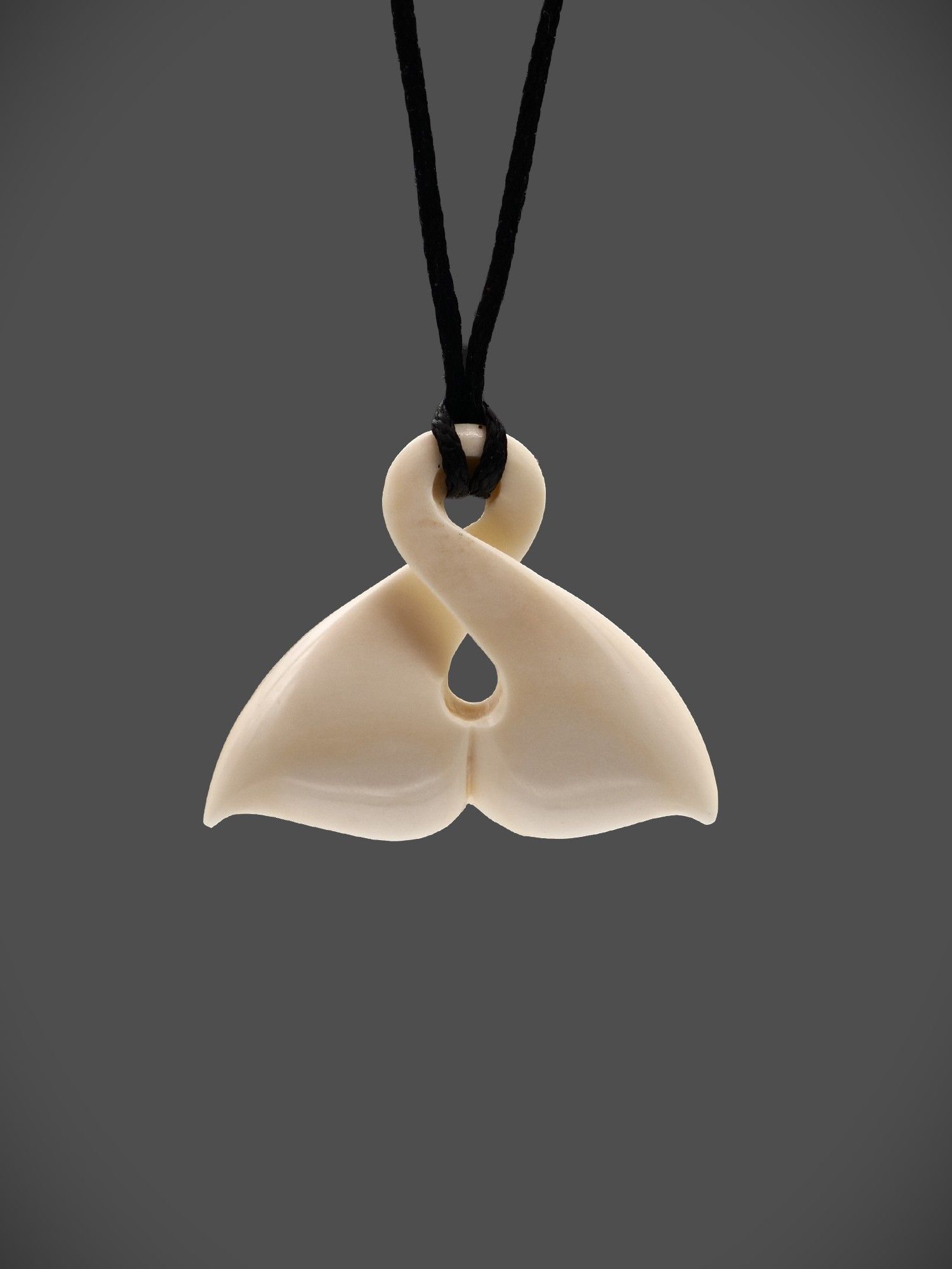 Moko Pounamu Pikorua Whale Tail Bone Carving - Omihi