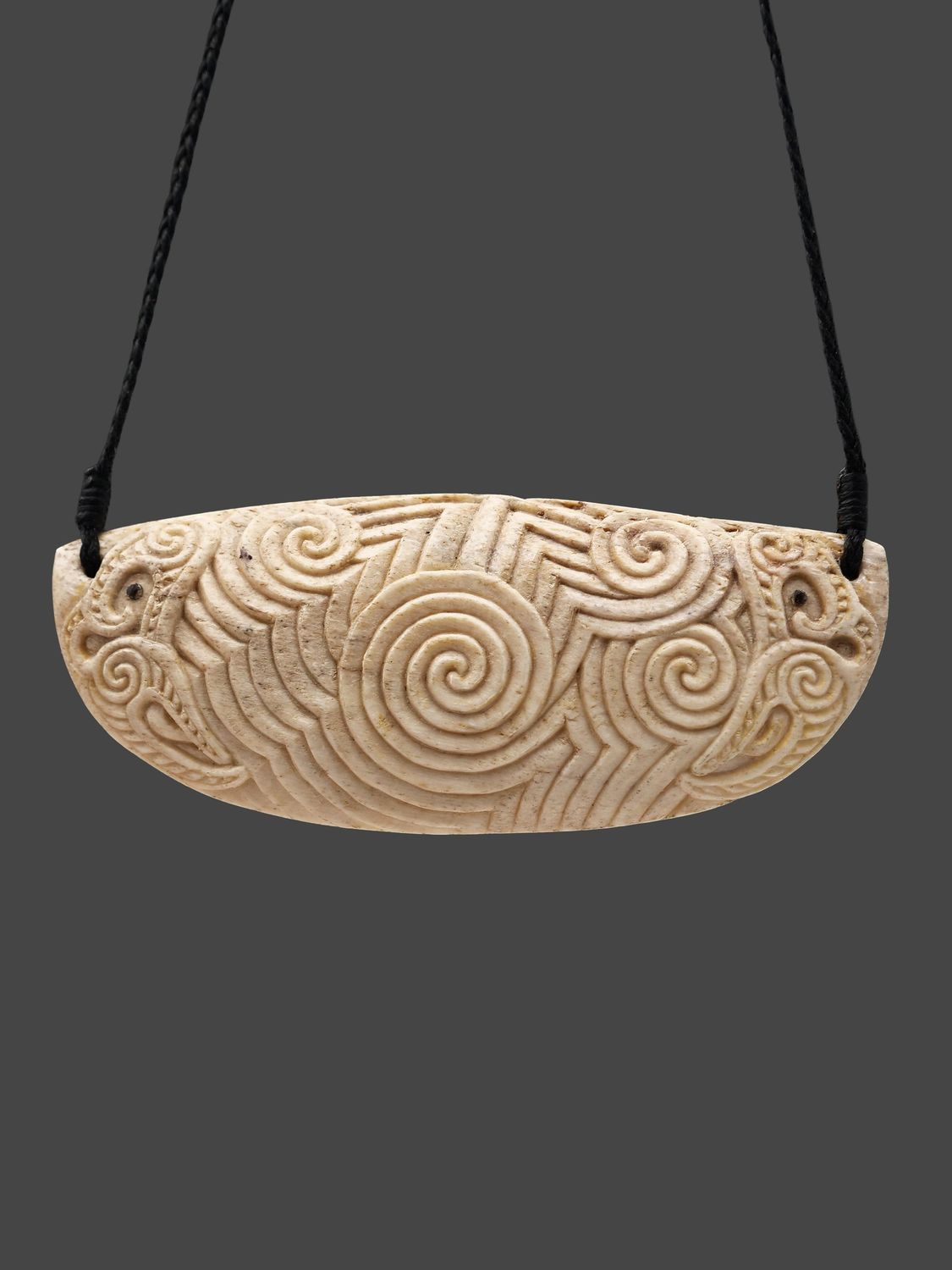 Moko Pounamu 'Ocean Currents' Genuine Whale Bone Carving - Muriwai Moko Pounamu 'Ocean Currents' Genuine Whale Bone Carving - Muriwai