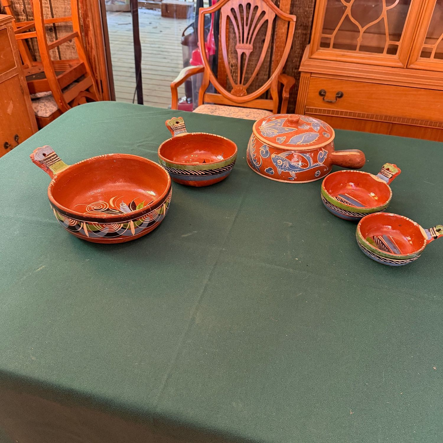 Group of vintage hand-painted Mexican pottery nesting serving dishes and covered casserole, up to 10 Group of vintage hand-painted Mexican pottery nesting serving dishes and covered casserole, up to 10"W, B0680