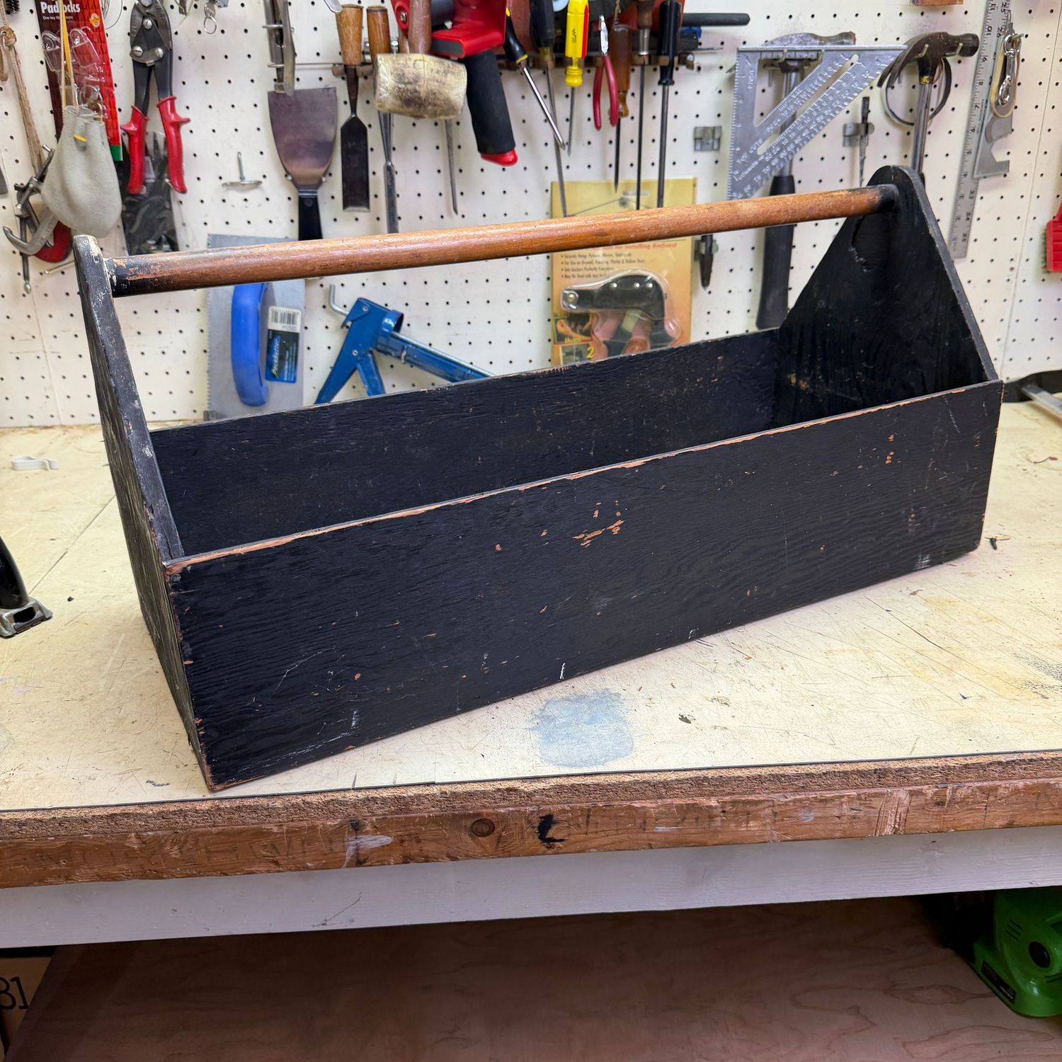 Long black plywood tool carrier, 12"H x 25"L
