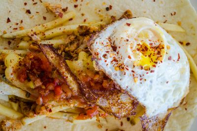 Greg Farmer Wrap (Chicken, Pebre Salsa, Cheese, Fried Egg, Fries, Homemade Mayonnaise) Greg Farmer Wrap (Chicken, Pebre Salsa, Cheese, Fried Egg, Fries, Homemade Mayonnaise)