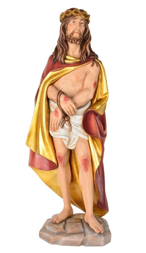 Jésus moqué, flagellé, couronné d'épines, vêtu d'une robe pourpre. Statue en bois.