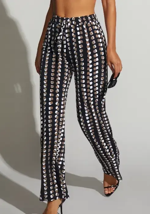 Close up of a model wearing Roidal Bambu Karai Beach Trousers in a studio setting.