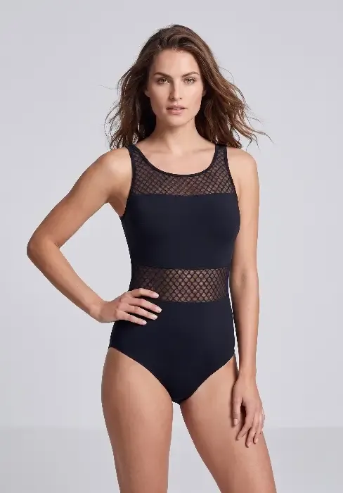 A model wearing an Anita Care Vera mastectomy swimsuit with soft foam cups & discreet pocketing in black lycra & mesh panels