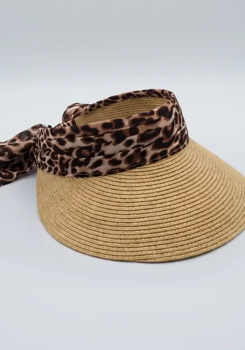 A model wears a Pia Rossini Augusta Visor in Animal print & Natural. Attractive scarf, expandable band for perfect fit.