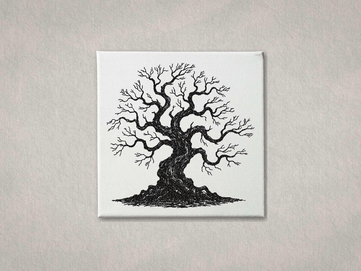 Black machine embroidery of a twisted oak tree sketch on a white stretched canvas frame.