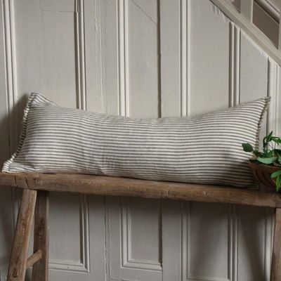 Esmee Olive Stripe Bolster cushion the ideal companion for a rustic wooden bench or window seat. A true statement piece.