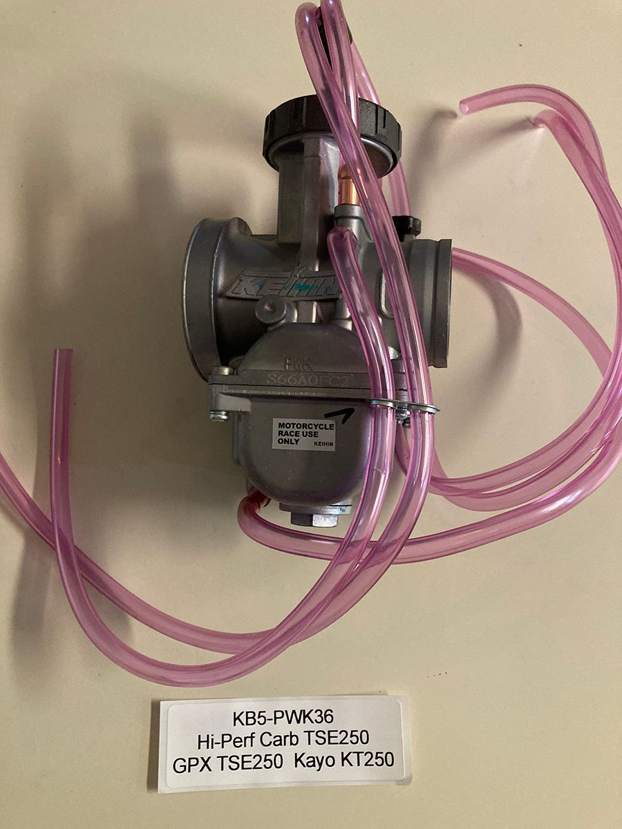 Modified PWK36 Carburetor for TSE250. This carb has a bored throat, and porter inlet for super high volume. We recommend using this carb with the FMF exhaust system.
