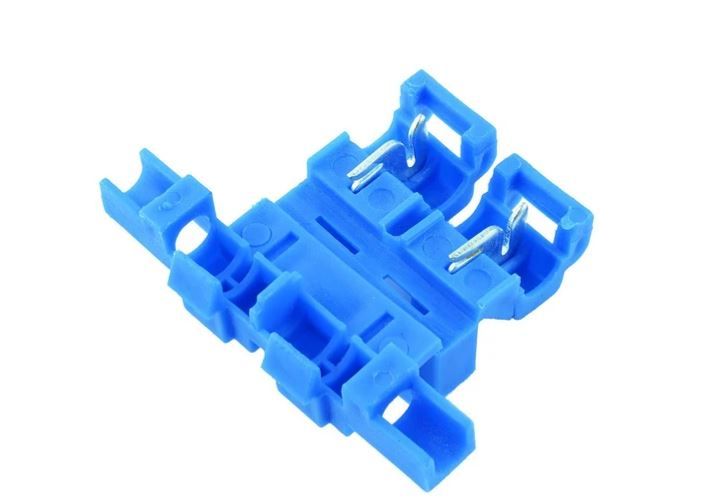 Self-Stripping Automotive Blade Fuse Holder