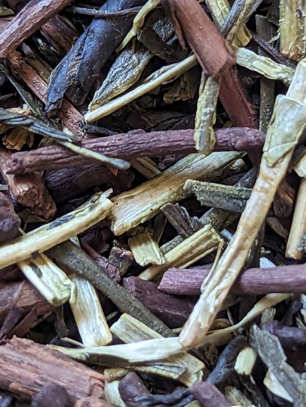 Green Tea, Golden Tea, and Twig Tea, blended together, shown with a close enough zoom to see all the textures.