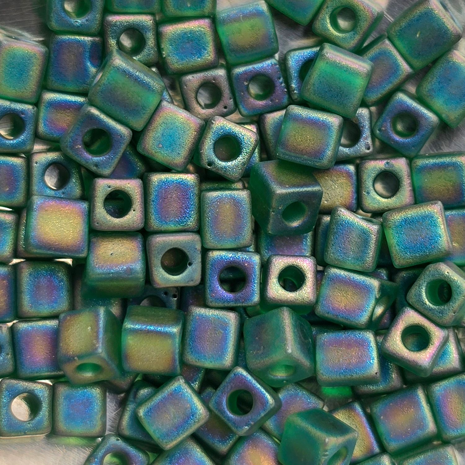 SB4-146FR: Miyuki Matte Transparent Green Rainbow - 4mm Square/Cube Beads