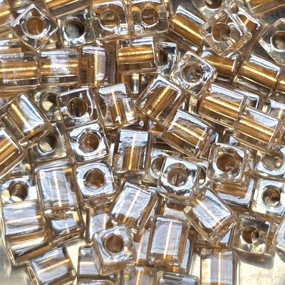 SB4-234: Miyuki Metallic Gold Lined Crystal - 4mm Square/Cube Beads