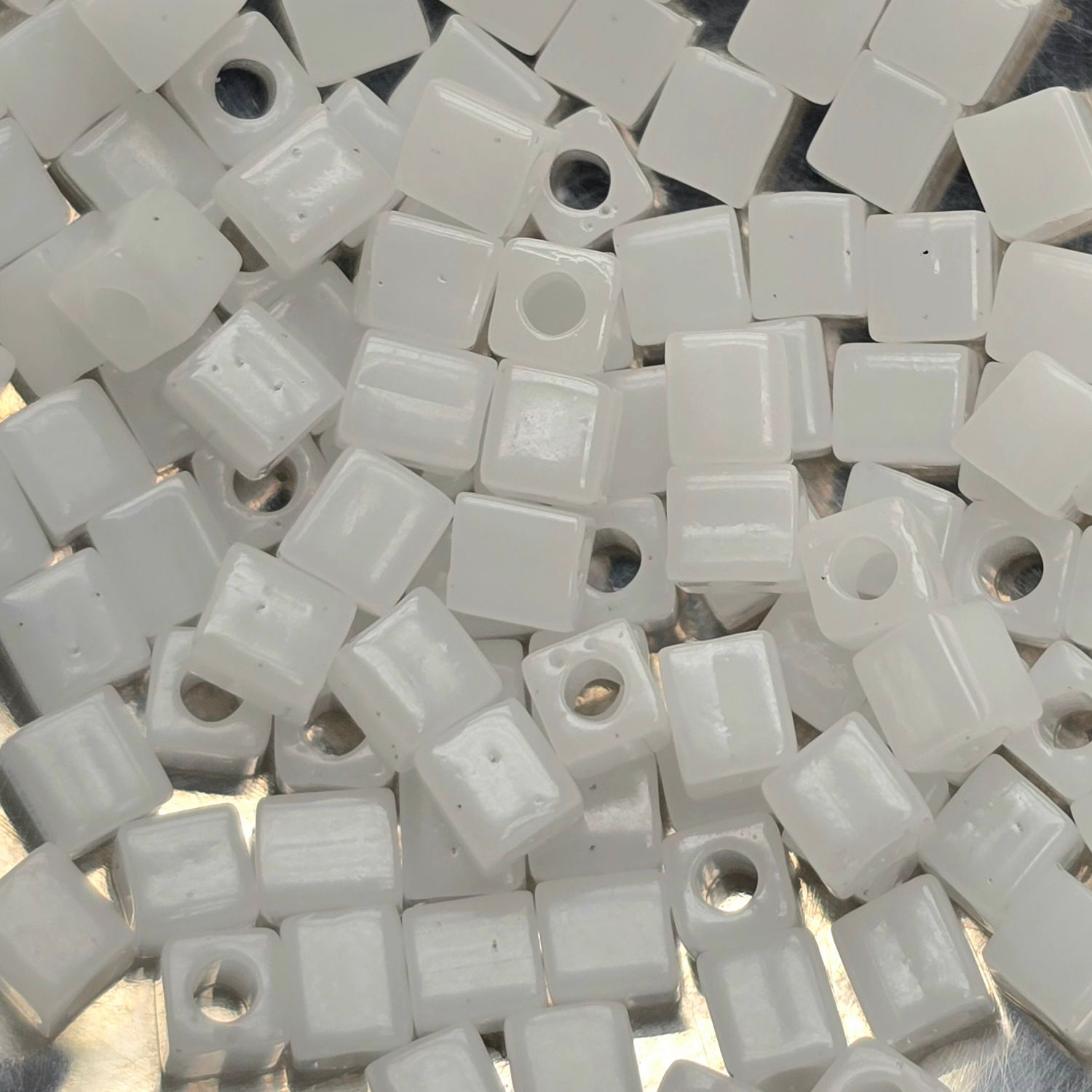 SB4-550: Miyuki White Translucent Luster - 4mm Square/Cube Beads