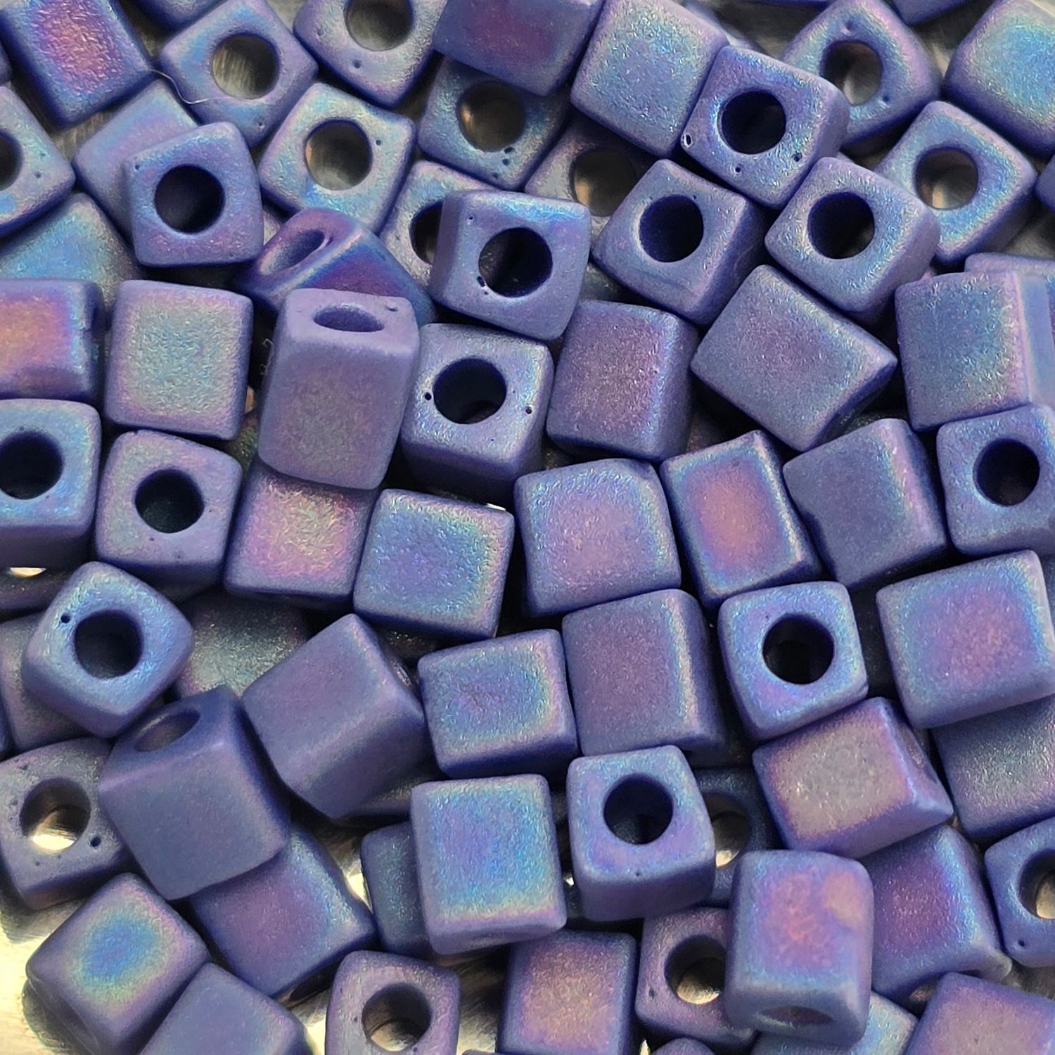 SB4-414FR: Miyuki Matte Opaque Dark Blue AB - 4mm Square/Cube Beads