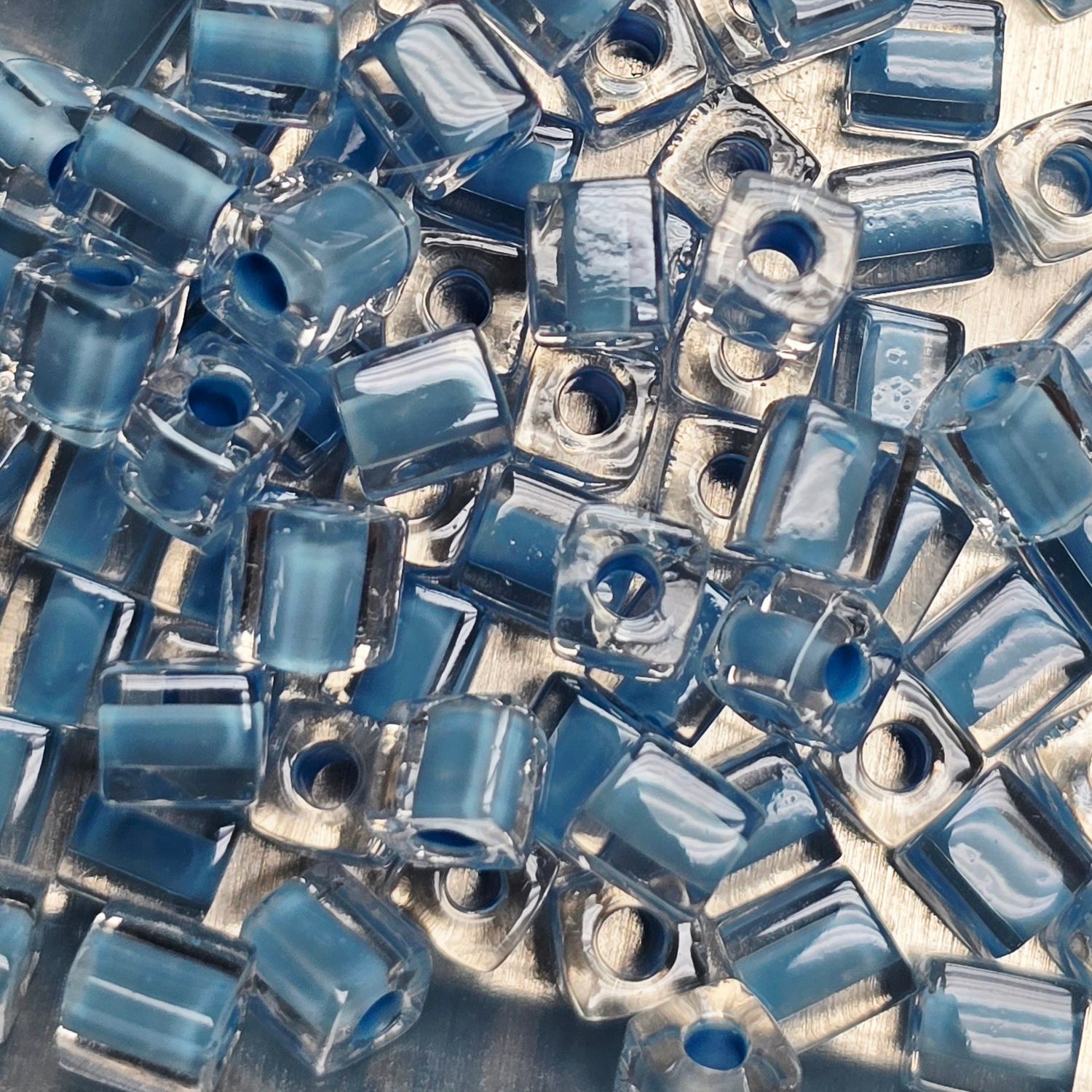 SB4-221: Miyuki Light Blue Lined Crystal - 4mm Square/Cube Beads