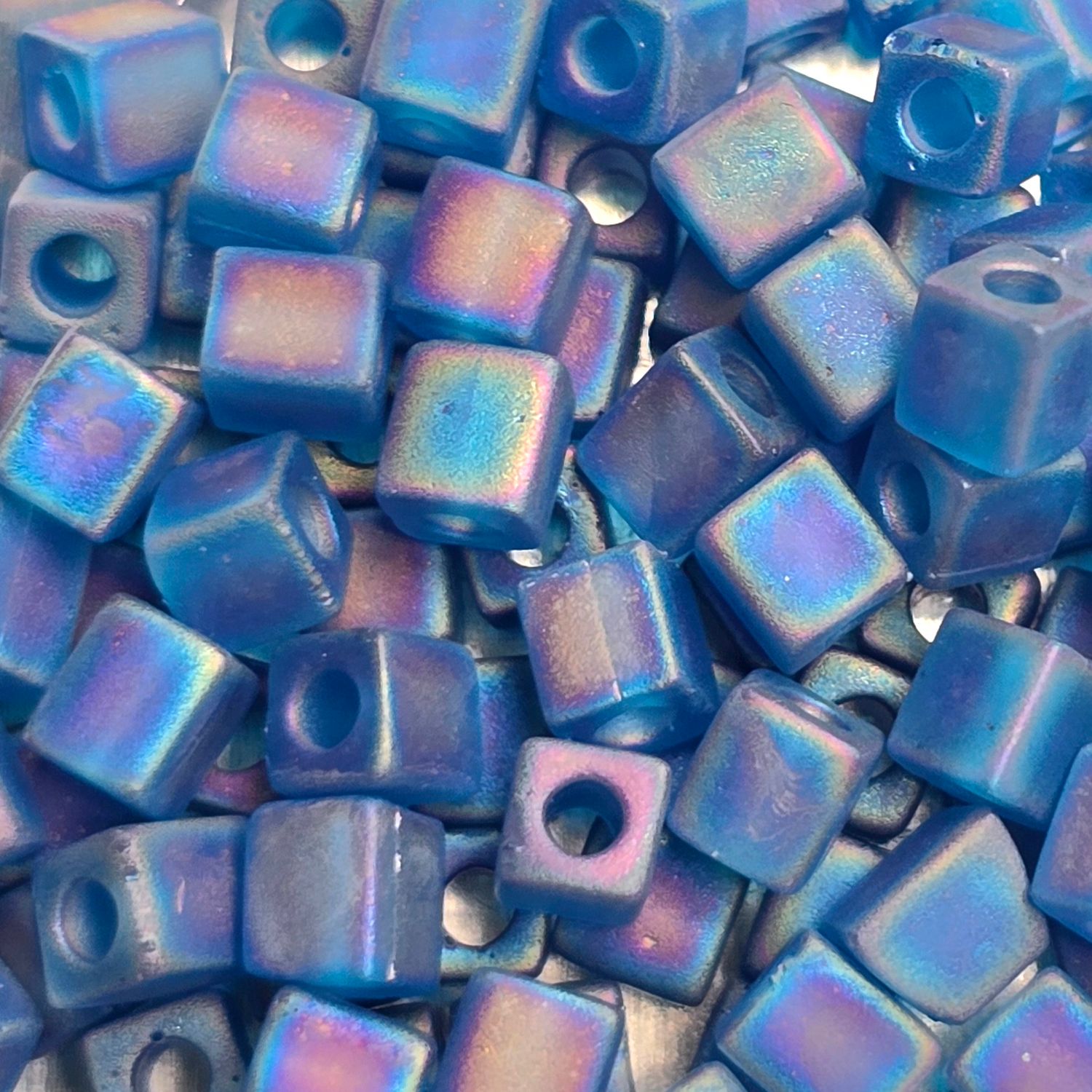 SB4-149FR: Miyuki Matte Transparent Capri Blue AB - 4mm Square/Cube Beads