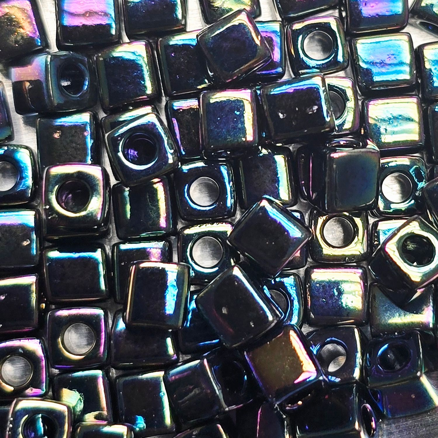 SB4-455: Miyuki Opaque Jet Rainbow - 4mm Square/Cube Beads