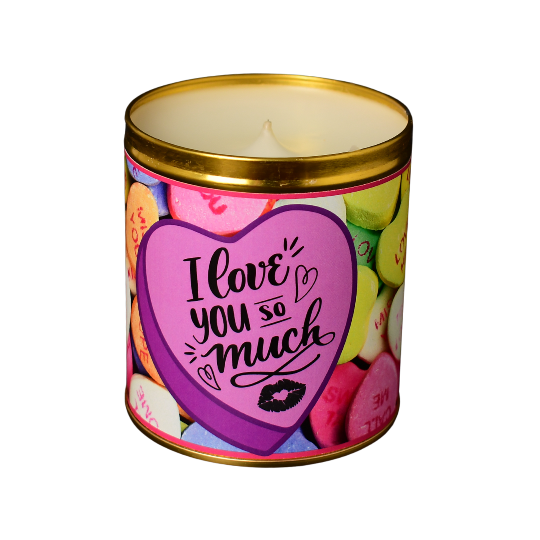 An Aunt Sadie's Candles Valentine's Day candle poured in a gold tin, with a candy hearts label that says 