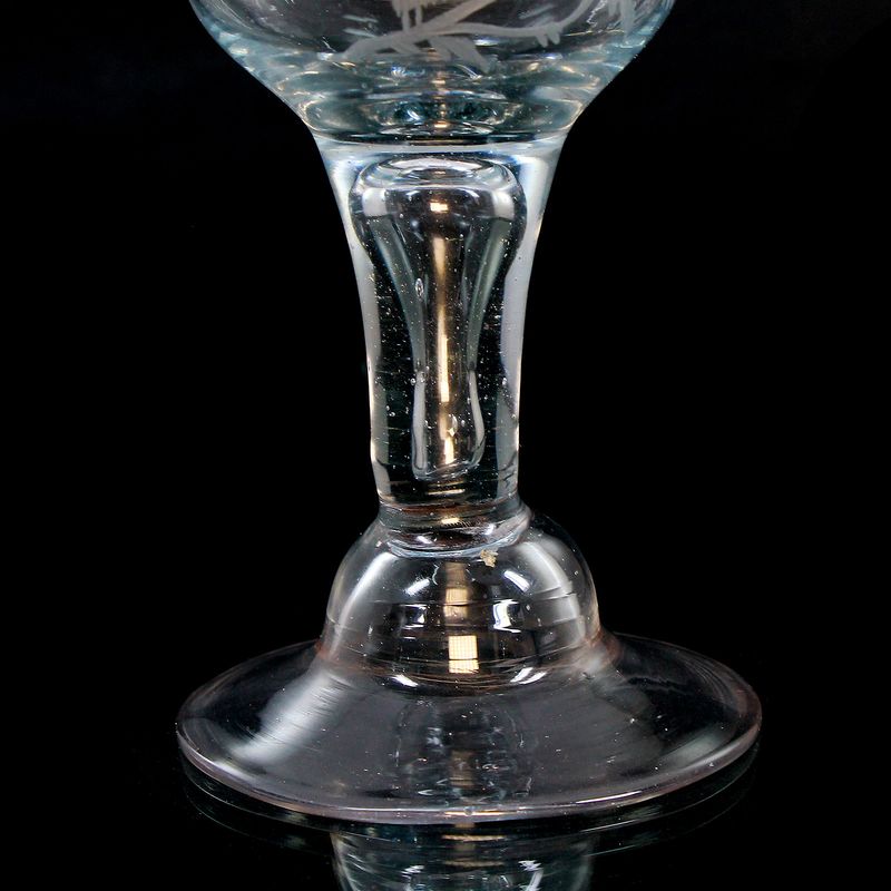 Jacobite cup made of light blue tinted glass with a moth, probably North German around 1745-60.