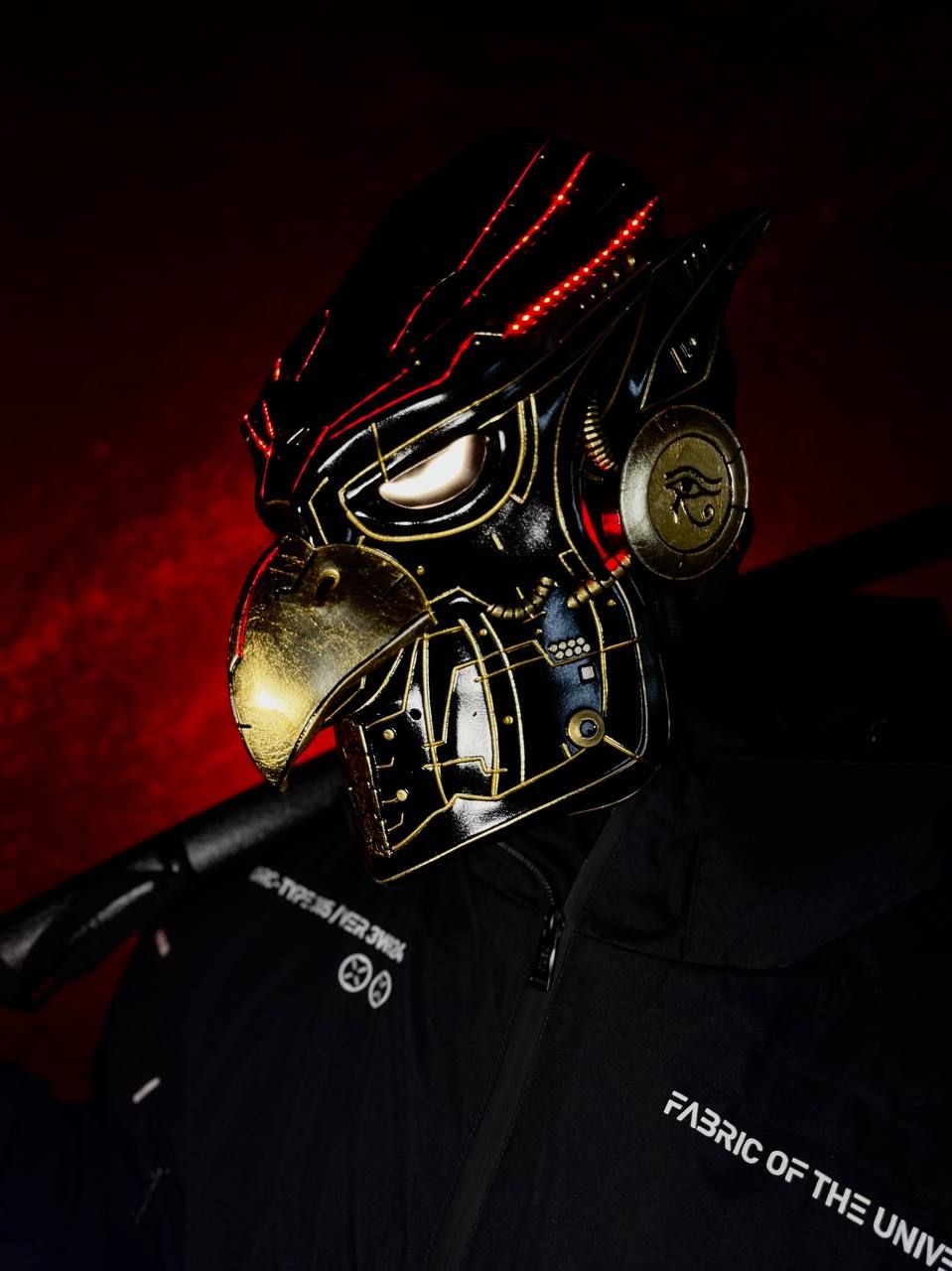 Black and gold Eagle mask with gold leaf details, golden beak and RGB LED lights, full face bird design