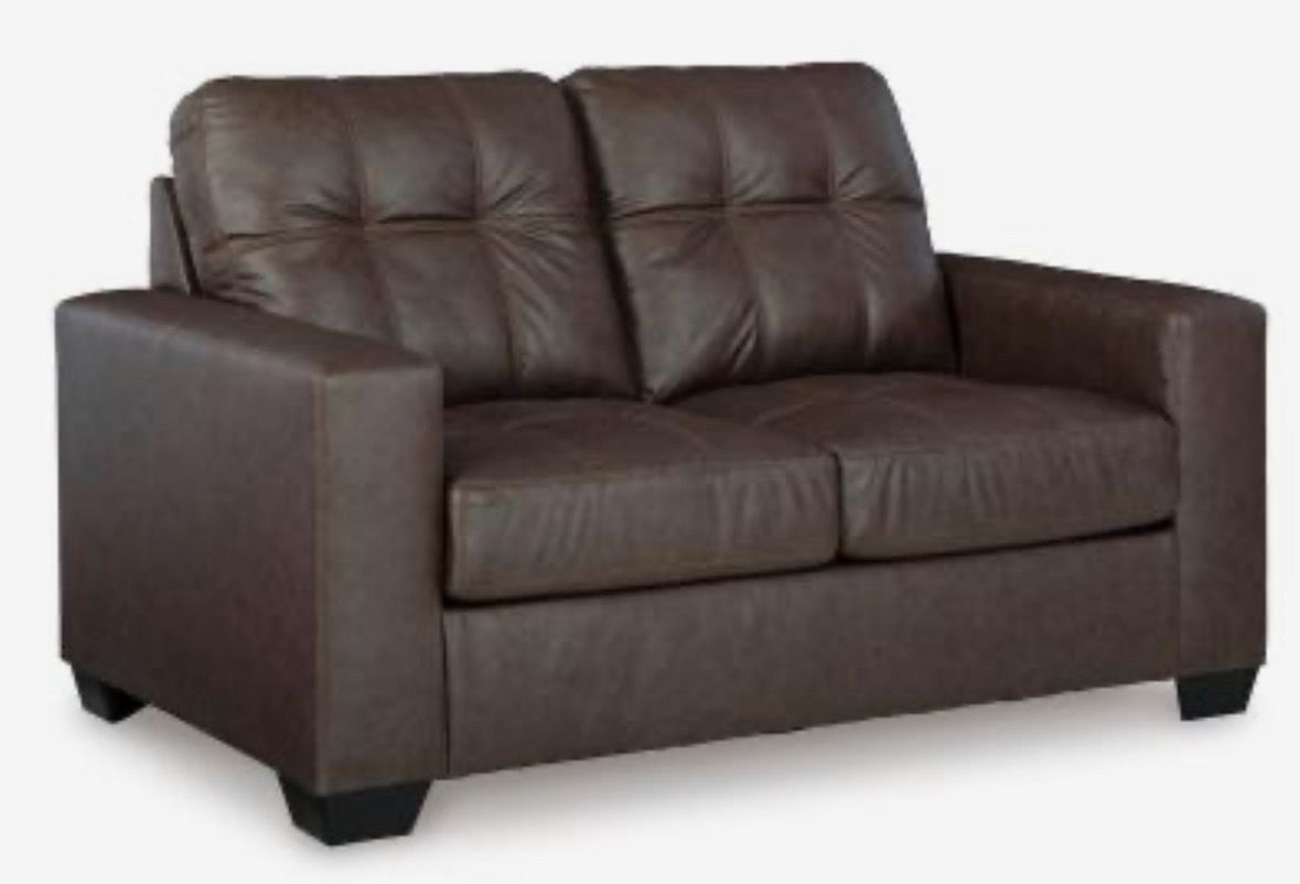 Modern Faux Leather Barlin Mills loveseat In Umber By Ashley Modern Faux Leather Barlin Mills loveseat In Umber By Ashley