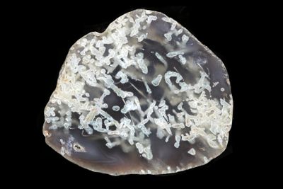 White tubular Moss Agate floating inside a grey Agate