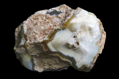 Creamy White broken Agate with a Quartz crystal Geode in it