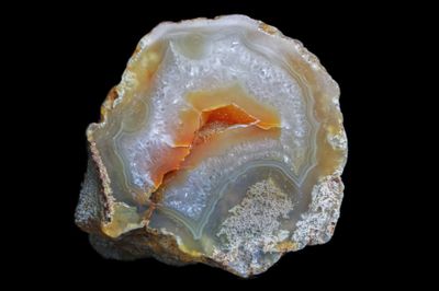 Fortified Agate with crystal and a floating Agate in the centre and a Geode and some Moss. 