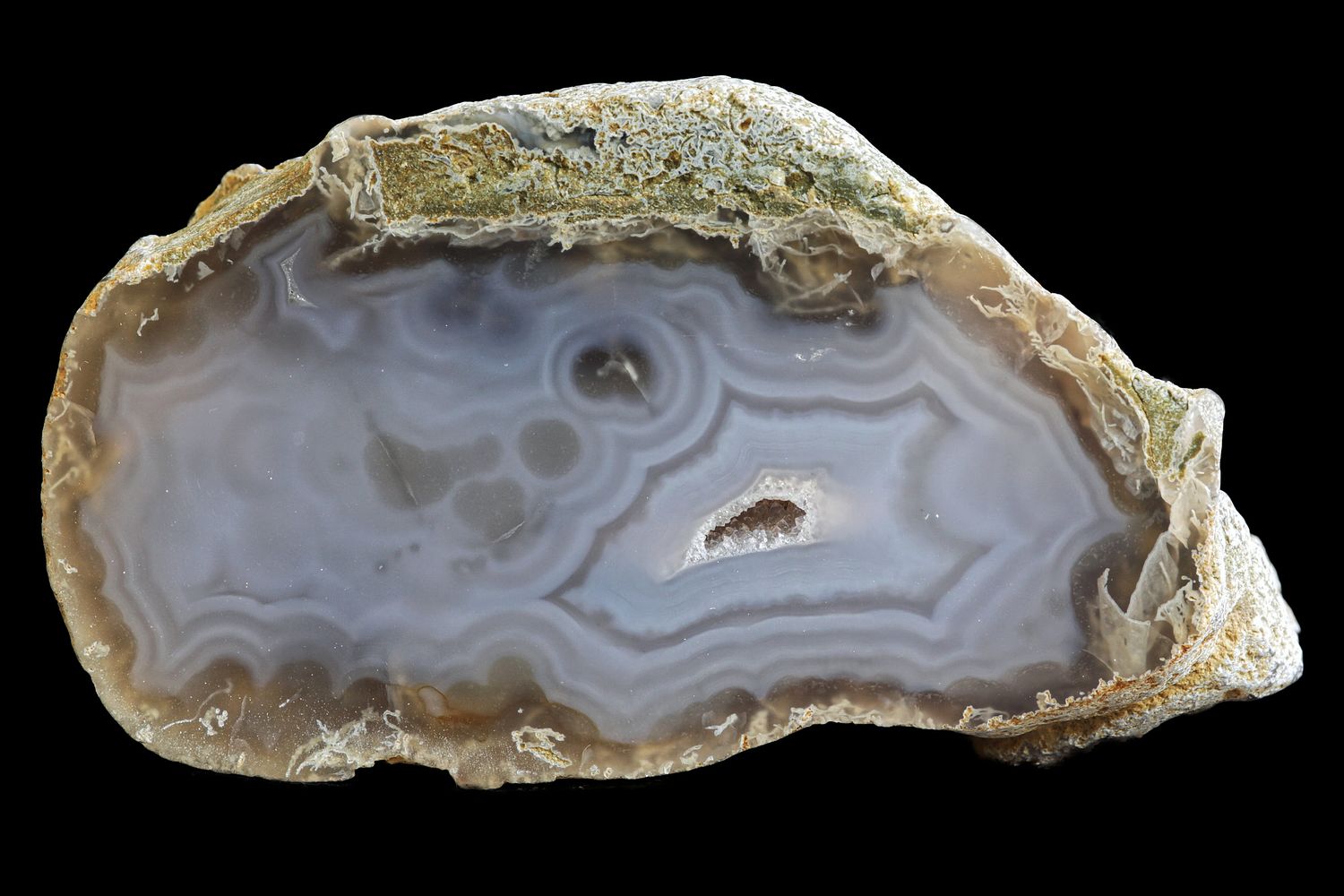 Fortification Agate with small bulls eyes, and a small Geode in it