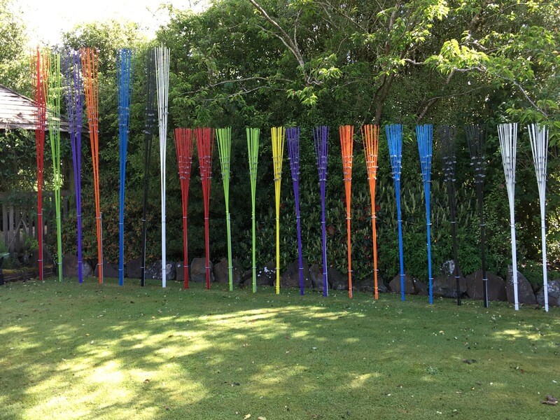 Windsticks 3m and 2m tall in all colors with stones, showcasing innovative bird feeders and kinetic sculptures