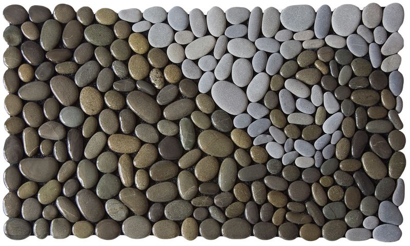 Handmade KORU OF THE LAND DARK Stonemat featuring a polished dark koru spiral surrounded by natural grey stones