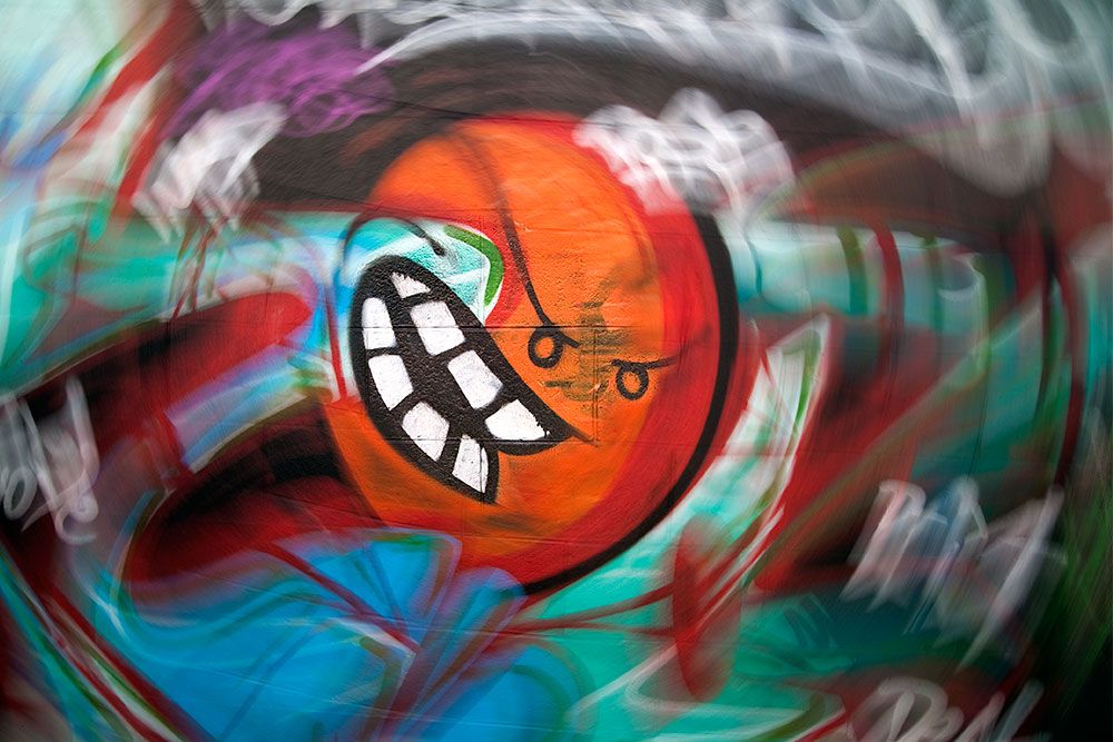Happy Orange Graffiti by Atomiko in Ōtautahi Christchurch