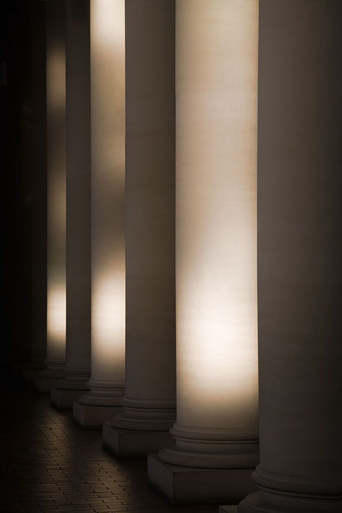 Basilica church columns with light shining through windows