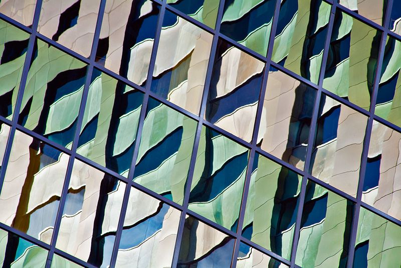 Reflections in glass facade of high-rise building, Christchurch CBD