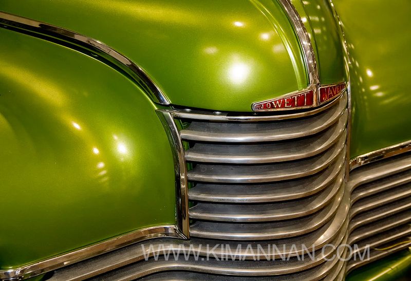 Close-up of the bonnet and front grill of a Javelin Classic Car in metallic green